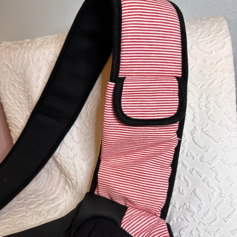 Pet carrier bag strap has a cell phone holder. The strap is padded like new.